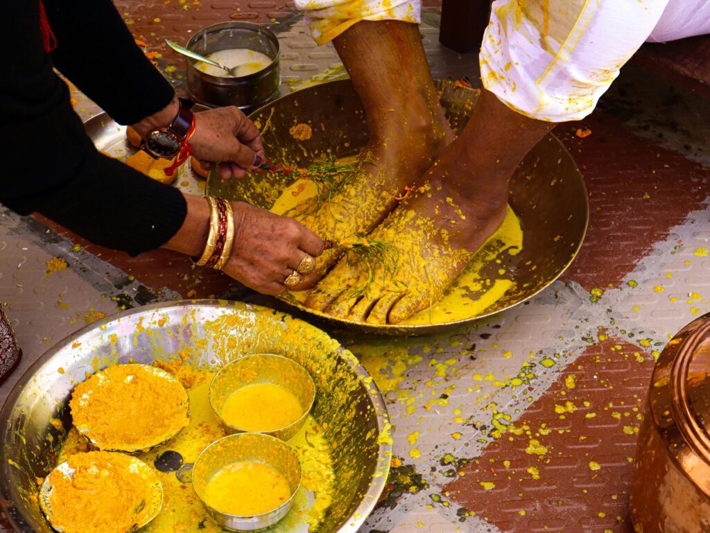 Close-up of a vibrant haldi ceremony in an Indian wedding, showcasing turmeric ritual.